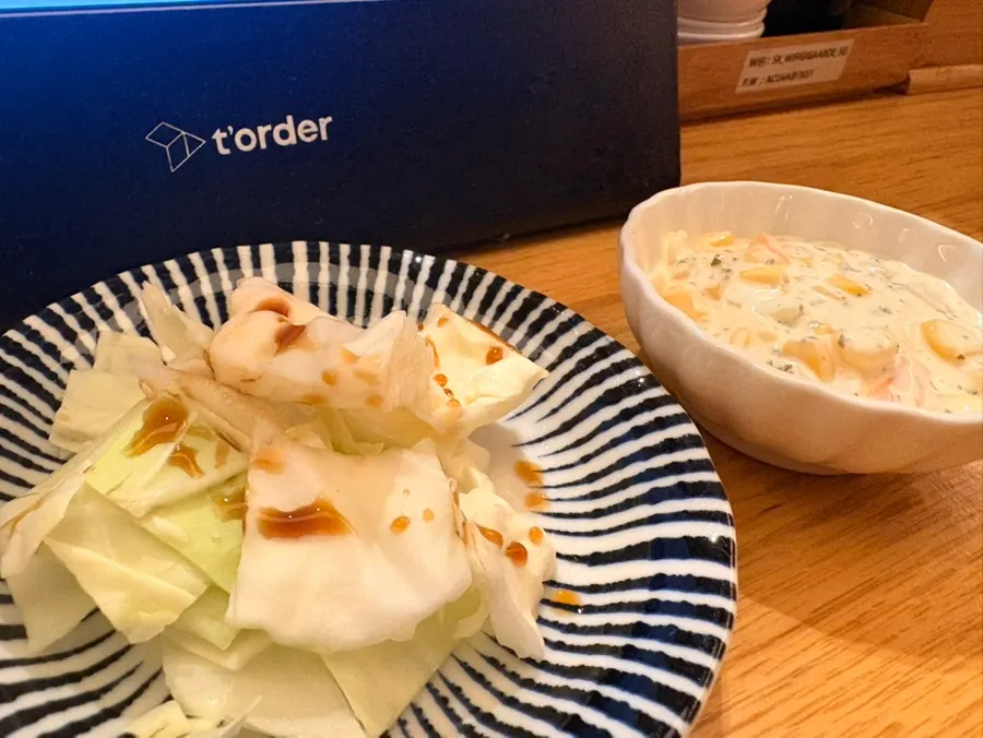 Complimentary cabbage and corn salad served as a starter