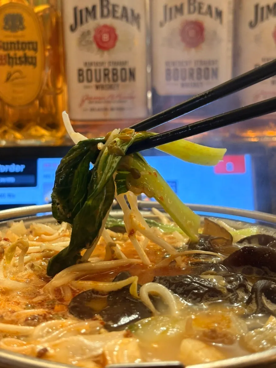 A spoonful of beef belly nagasaki champon broth