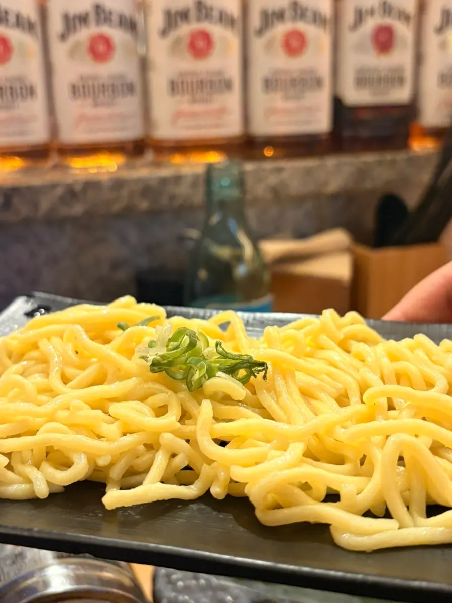 Lifting up the champon ingredients with chopsticks