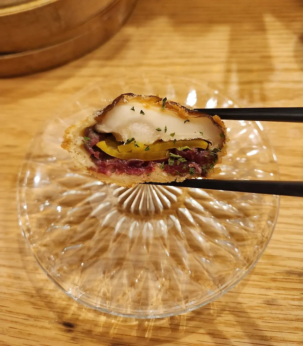 Sashimi and fritters served as bar snacks