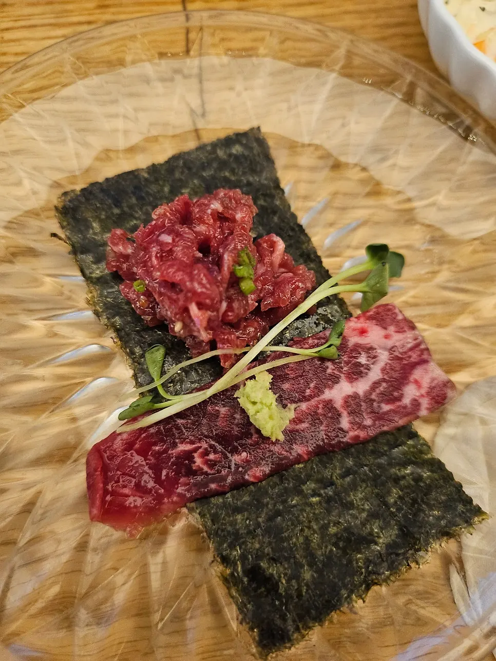 Yukhoe mixed with a popped egg yolk