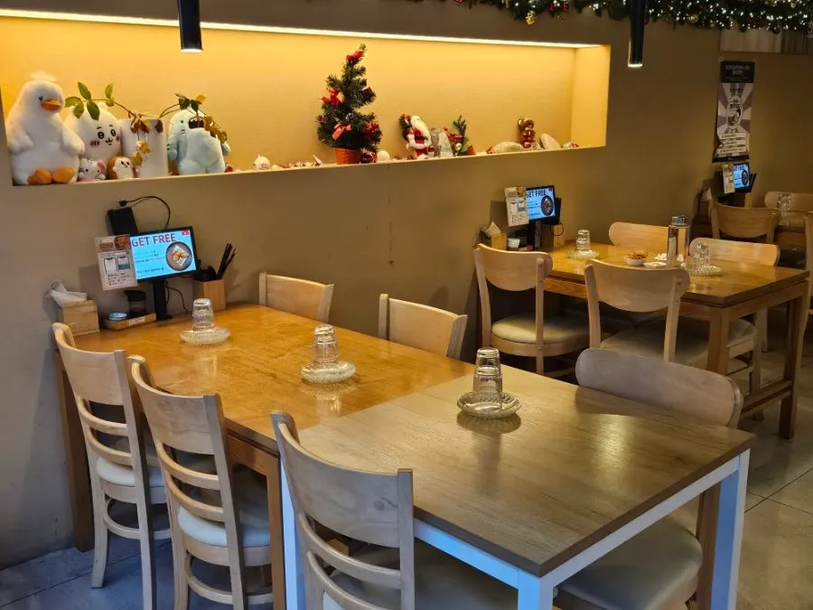 Table seating inside 12.24 Seomyeon Branch with Christmas decorations