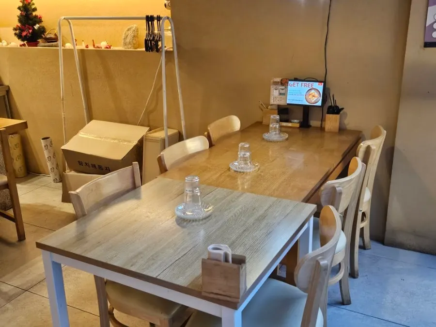 View of the bar seats where guests sit side by side