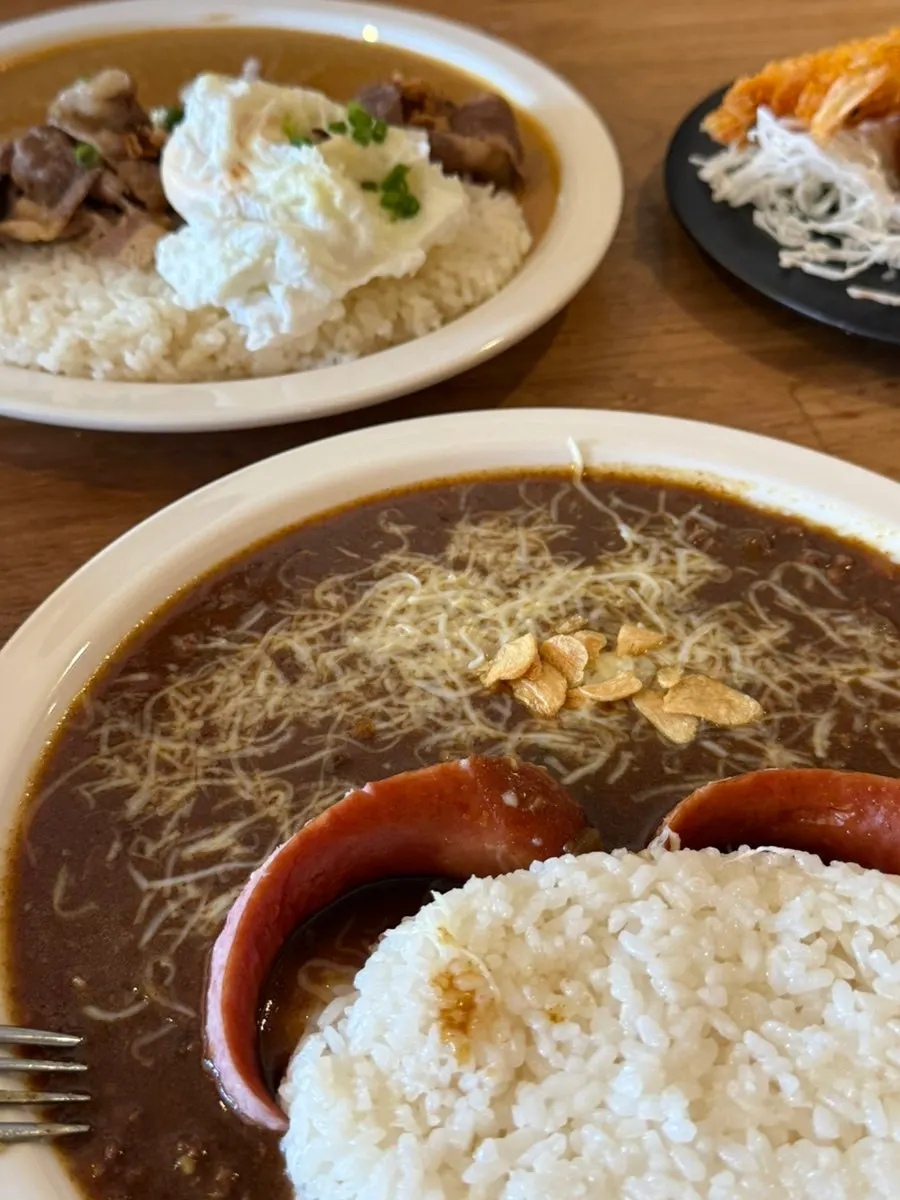 Special curry served with sausage and a poached egg