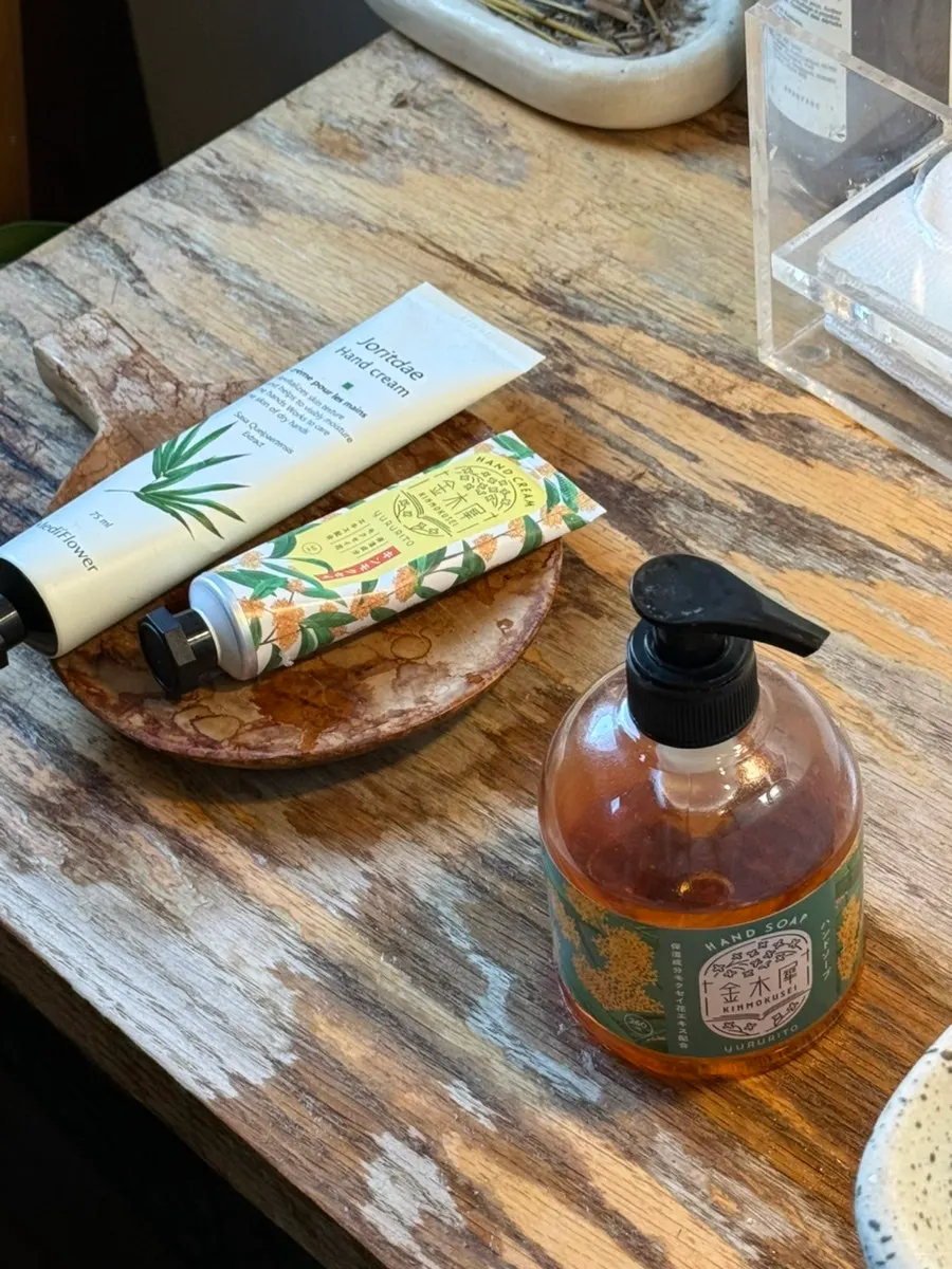 Golden osmanthus hand wash and hand cream displayed in a corner
