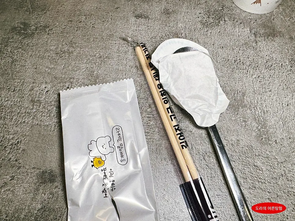 Individually wrapped set of chopsticks and spoon