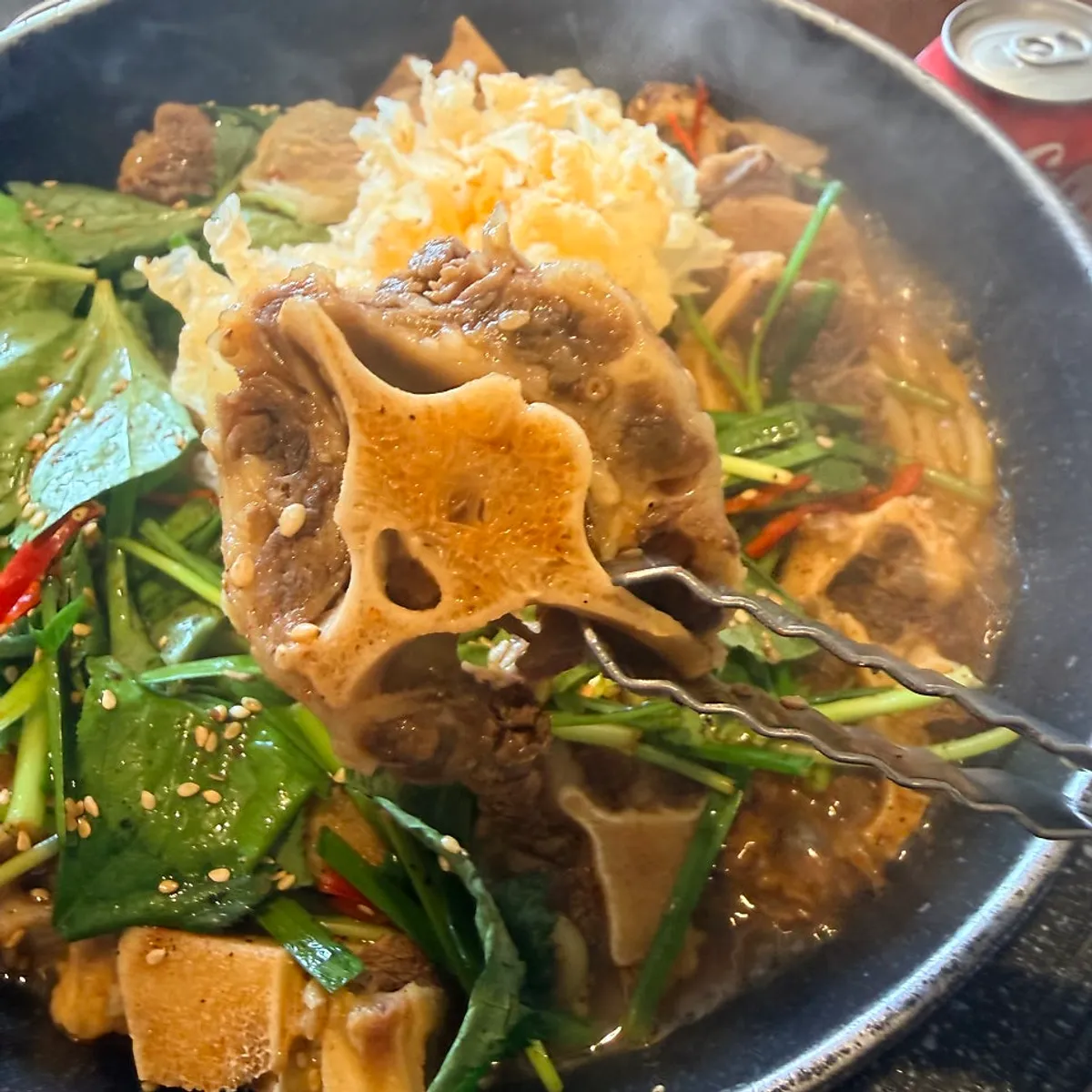 Ox tail suyuk topped with silver ear mushrooms and chamnamul