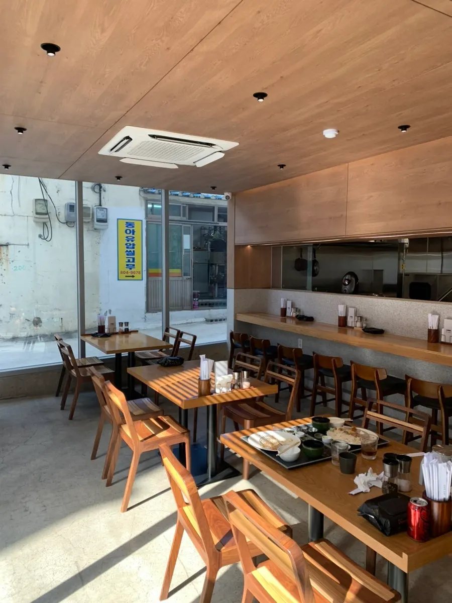 Interior of Katsu Gimseondo with light from the full-height windows