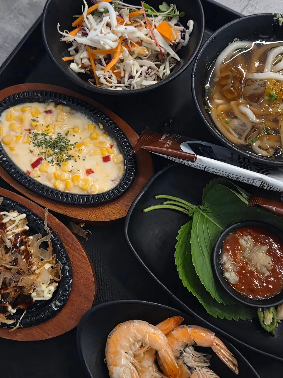 Side dish spread with corn cheese and tteokbokki