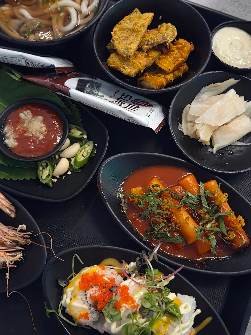 Rolls and fried food side dishes on the tray