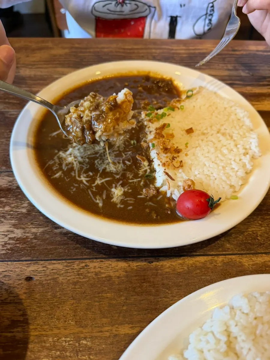 Beef curry topped with cheese