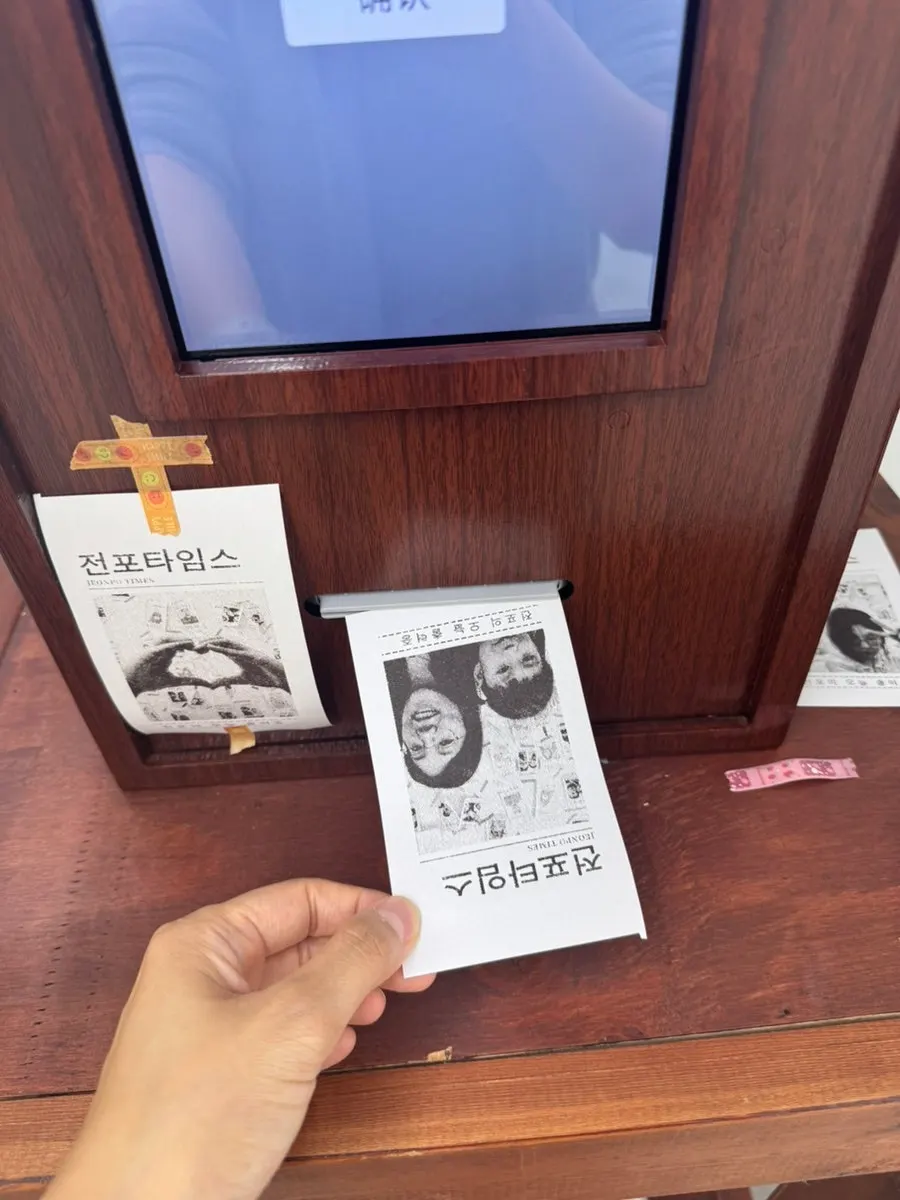Black-and-white keepsake photo stuck on the wall