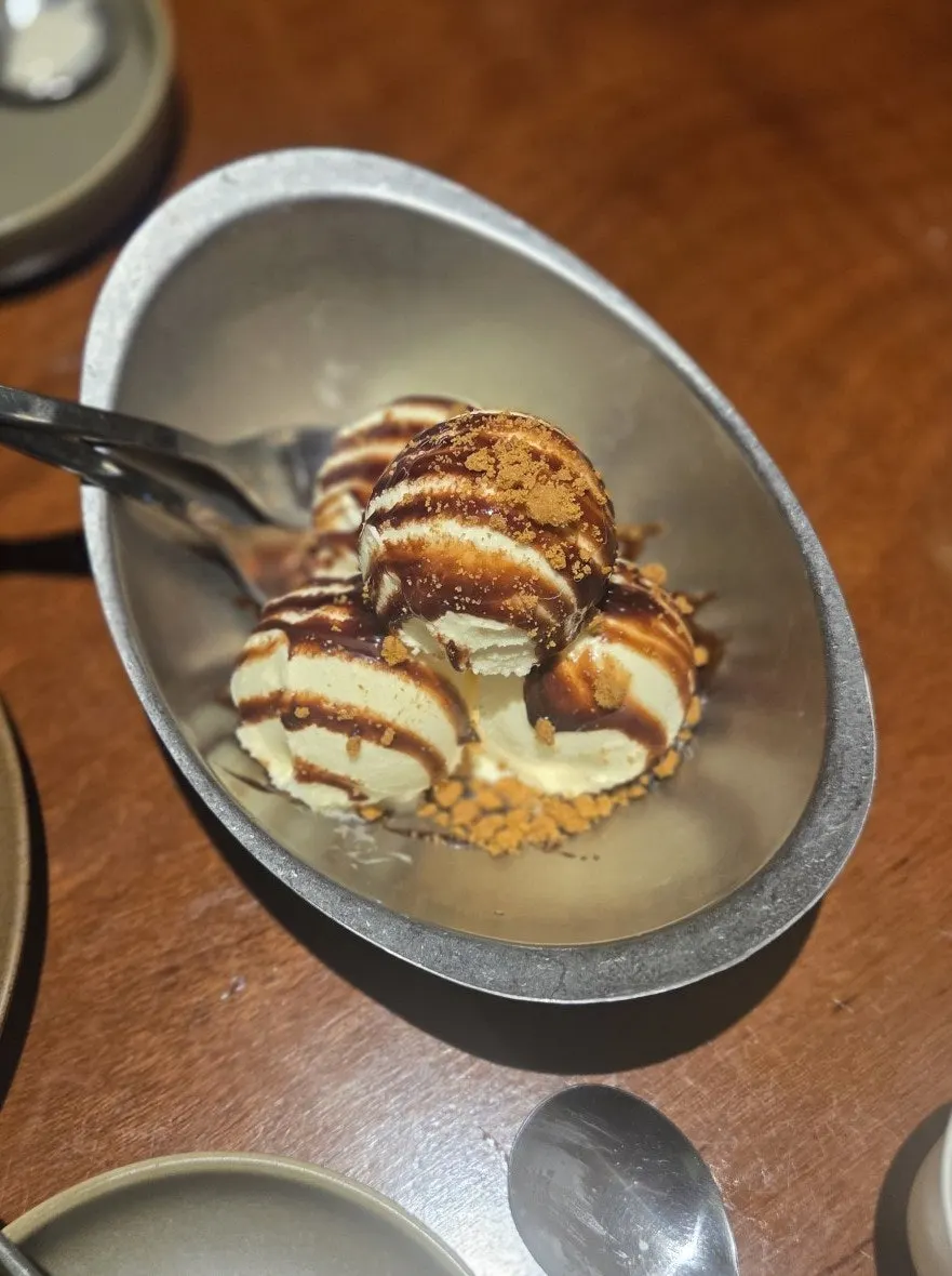 Ice cream drizzled with chocolate sauce