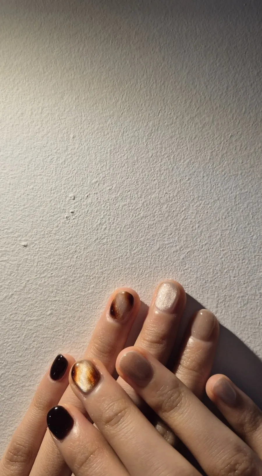 Brown nail art with silver accents