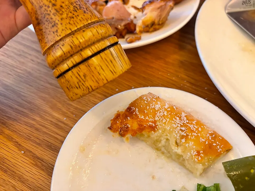 Cross-section of pizza crust cut with a knife