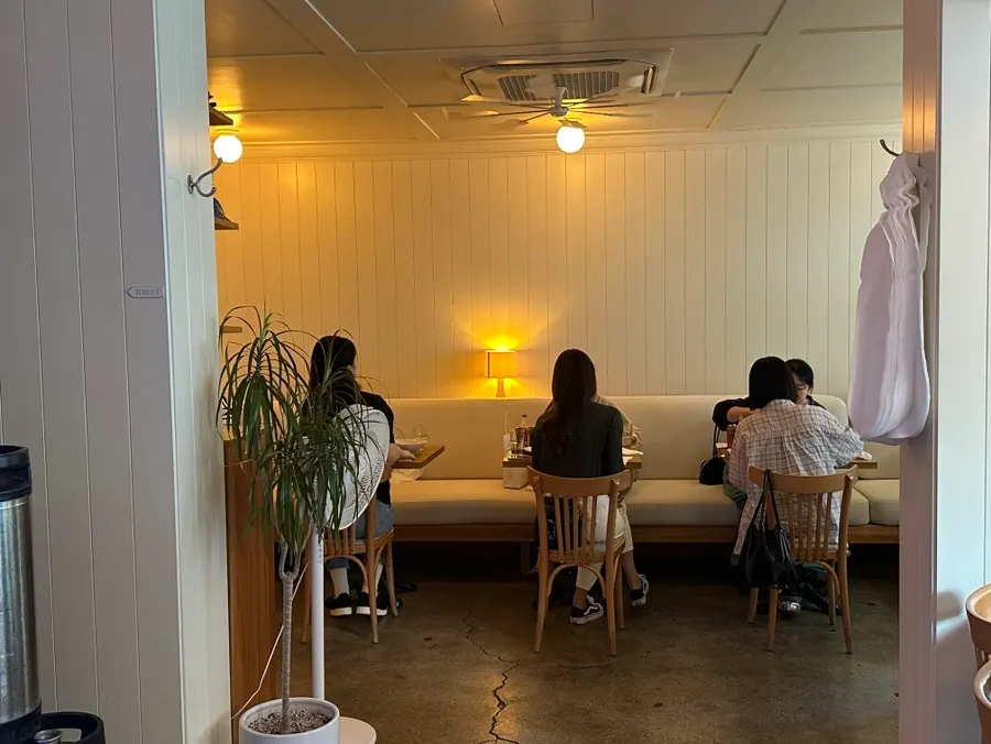 Pickles dining room with two-seat and four-seat tables