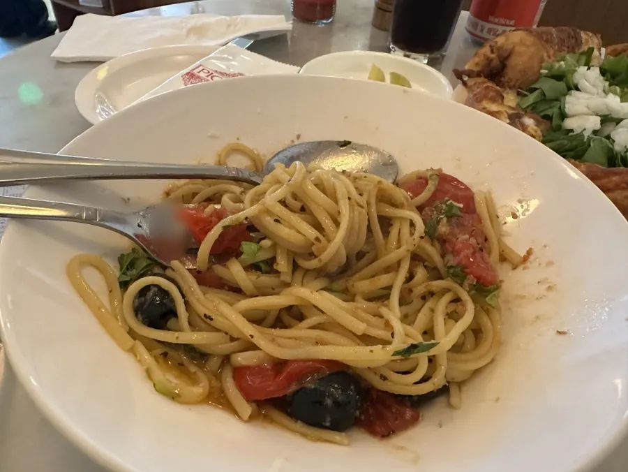 Wide noodles lifted from the puttanesca pasta