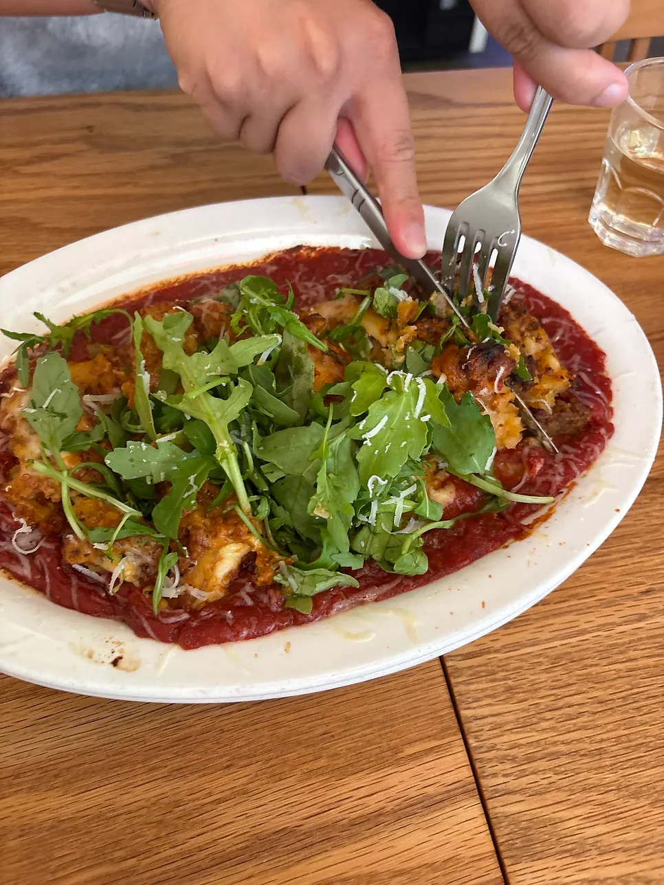 Lasagna covered in ragù sauce