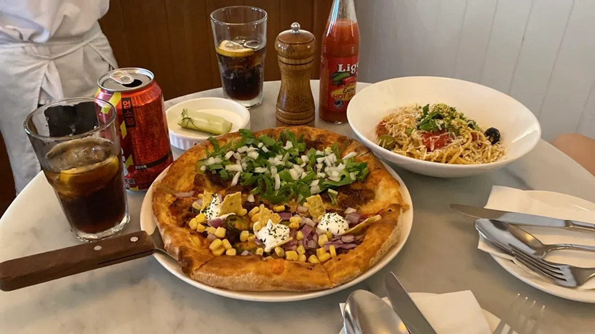 A full table setting with the Pickles half-and-half pizza and pasta set