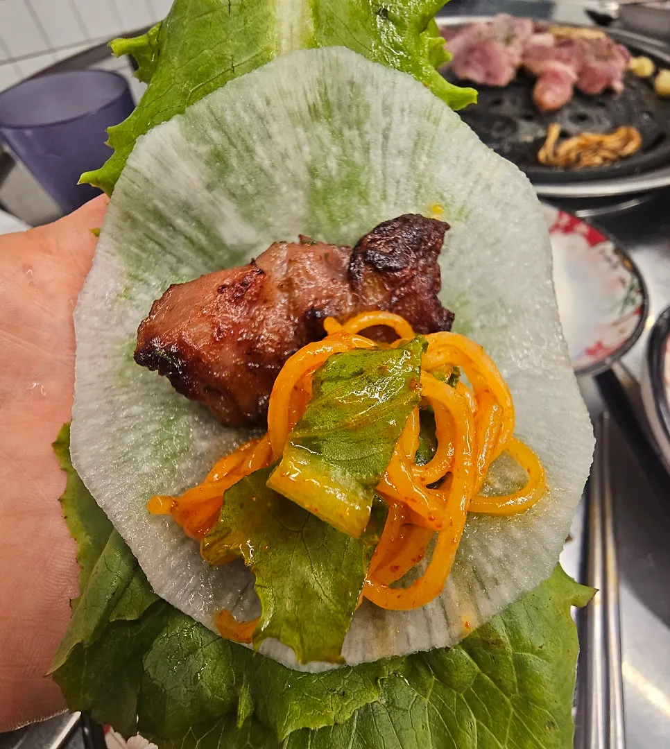 A bite combining bibim-myeon and meat