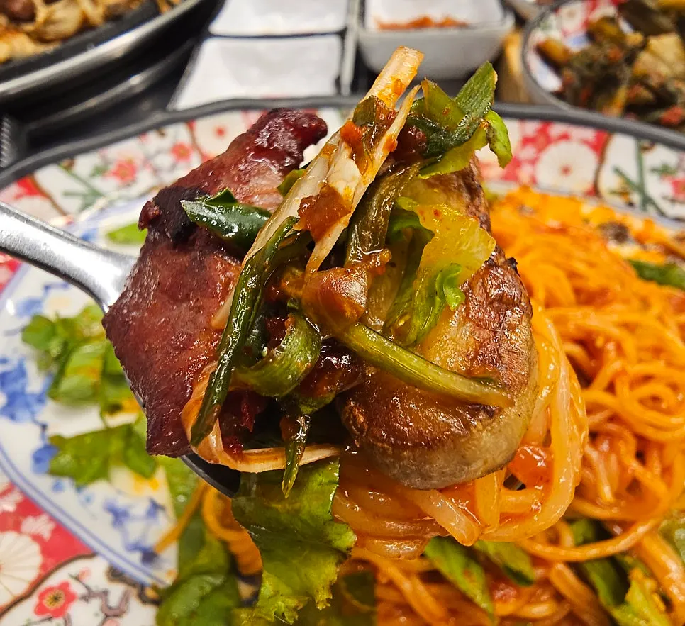 Meat paired with bibim-myeon and scallion salad