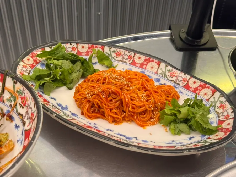 Bibim noodles and dubu kimchi served as basic banchan