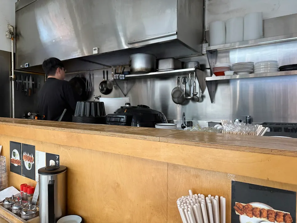 Interior seating at Ryusenso facing the kitchen