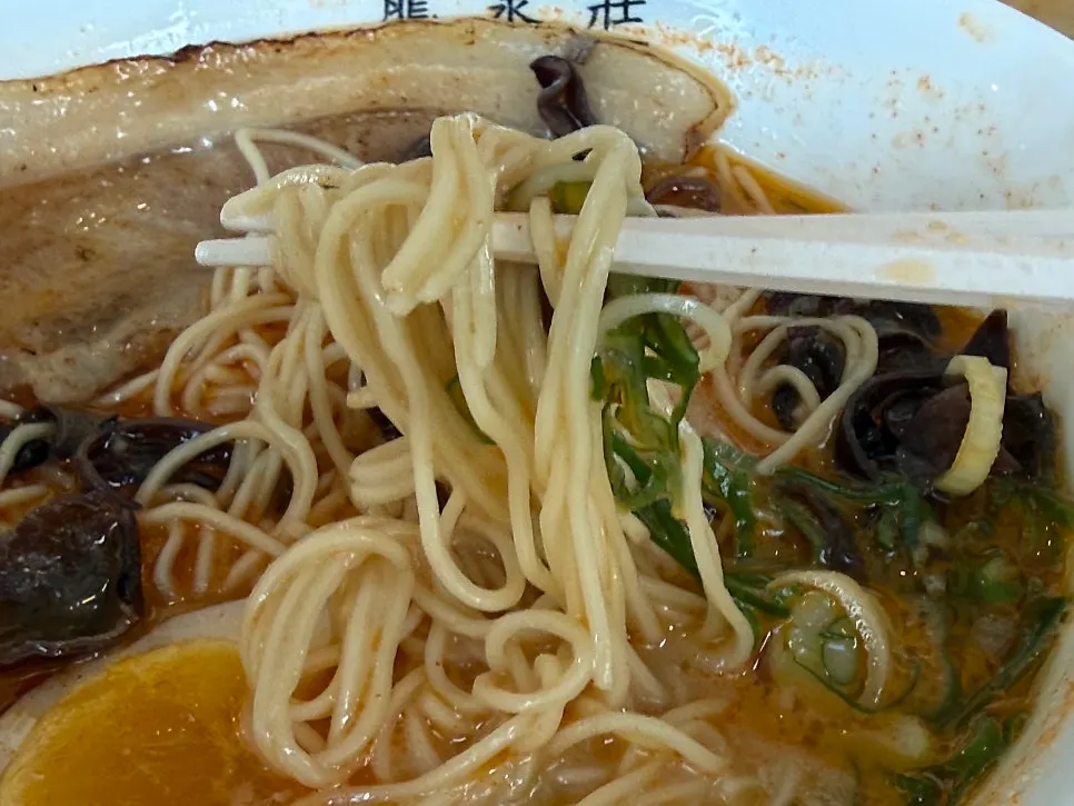 Kara ramen topped with chashu and egg