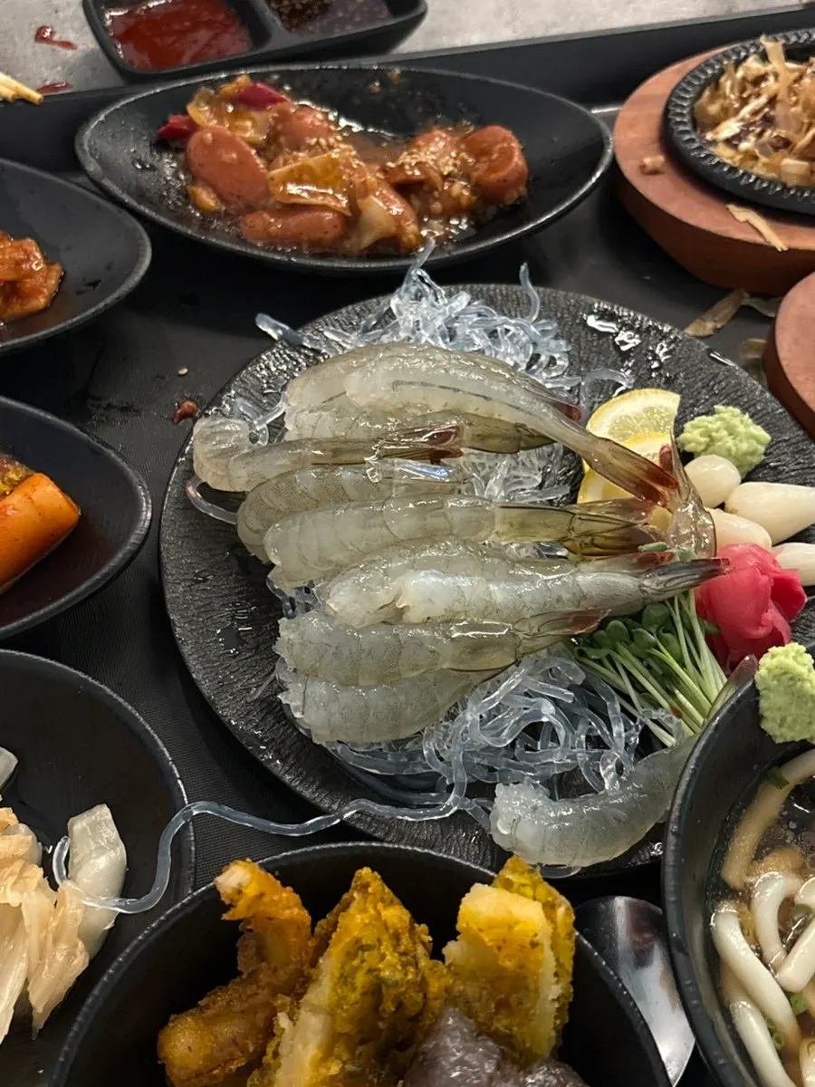 Raw shrimp meat peeled and prepared by staff