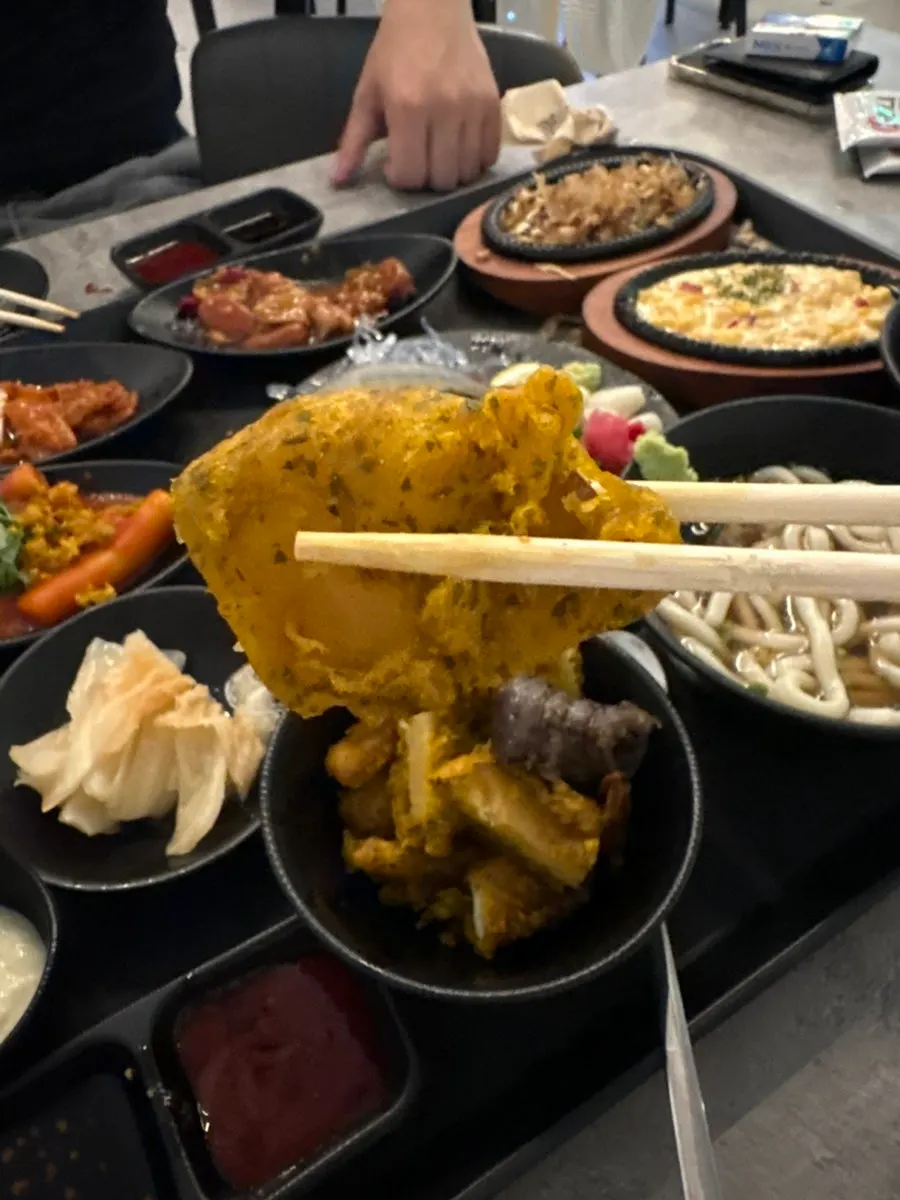 A drink enjoyed alongside the raw shrimp side dish