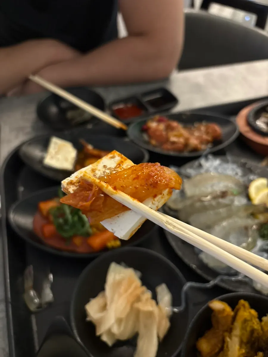 Plates of side dishes sampled one by one