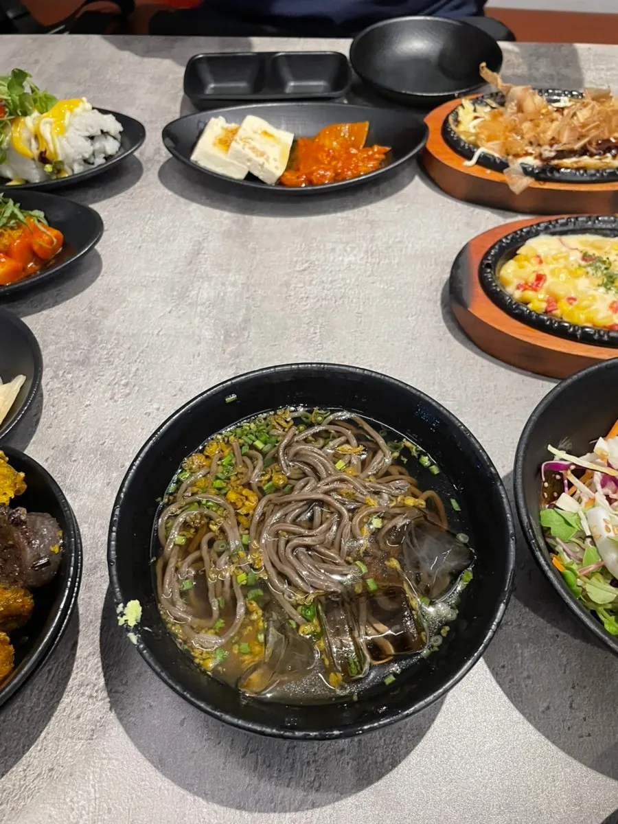 Plate of tteokbokki and fried food included in the banchan