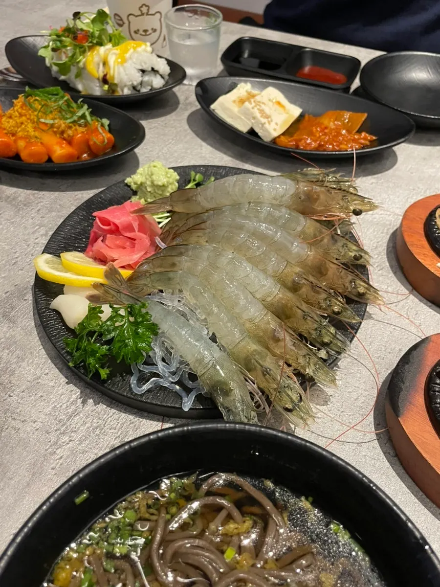 Plate of raw shrimp sashimi pulled straight from the tank