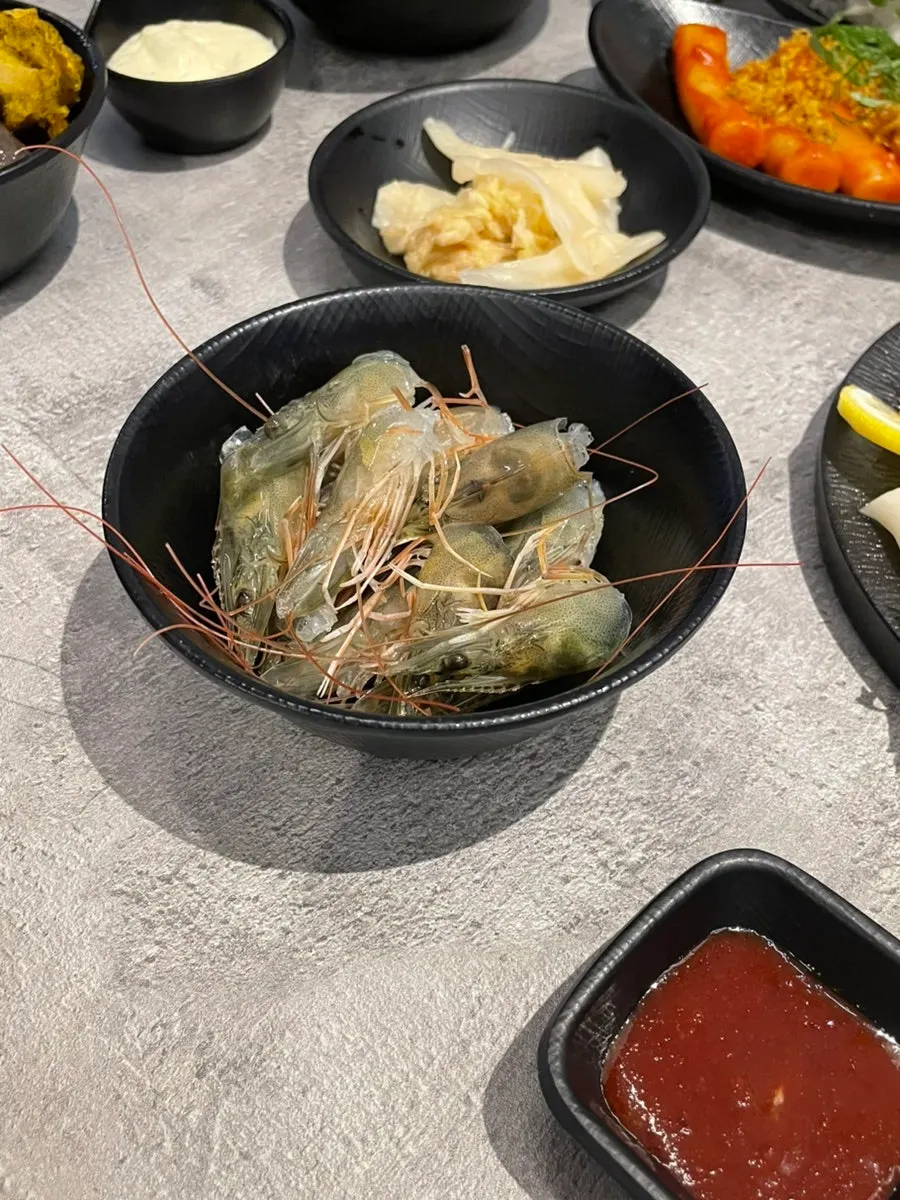 Raw shrimp sashimi served with vinegar-gochujang sauce