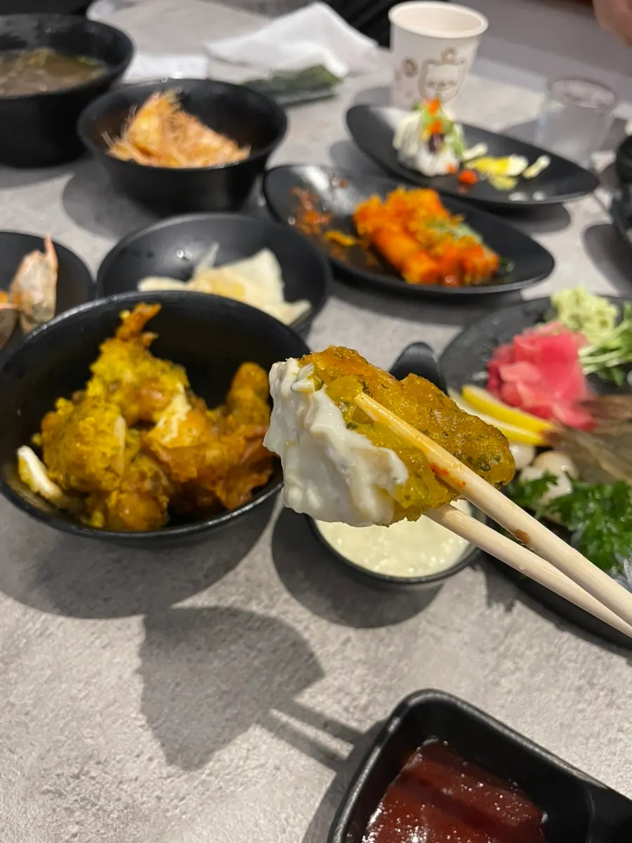 Fried shrimp heads alongside other fried banchan