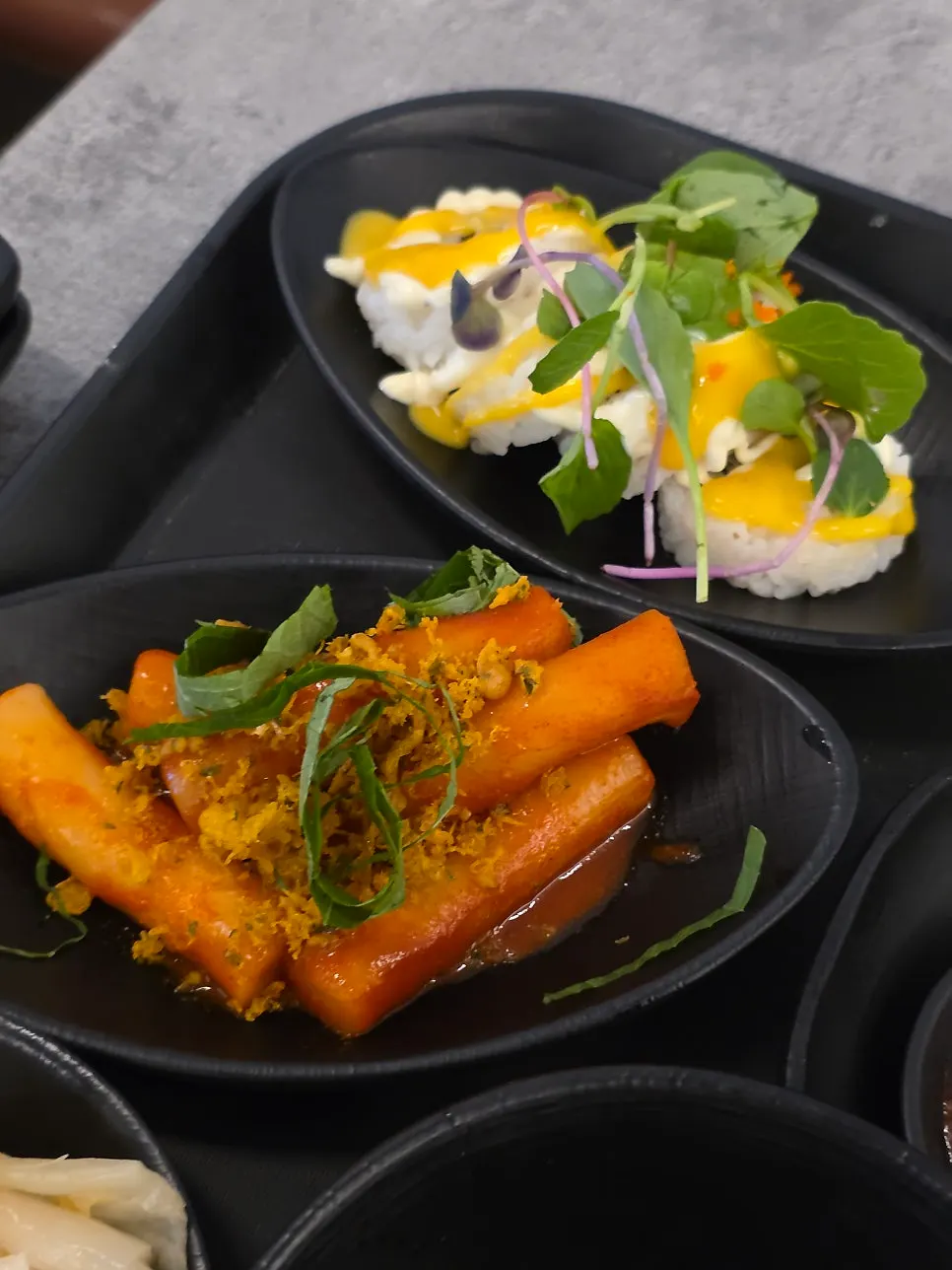 Fried squid, fried sweet potato, and tteokbokki side dishes