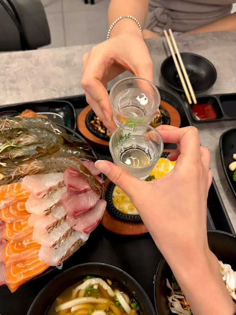 A bottle of soju paired with the raw shrimp sashimi