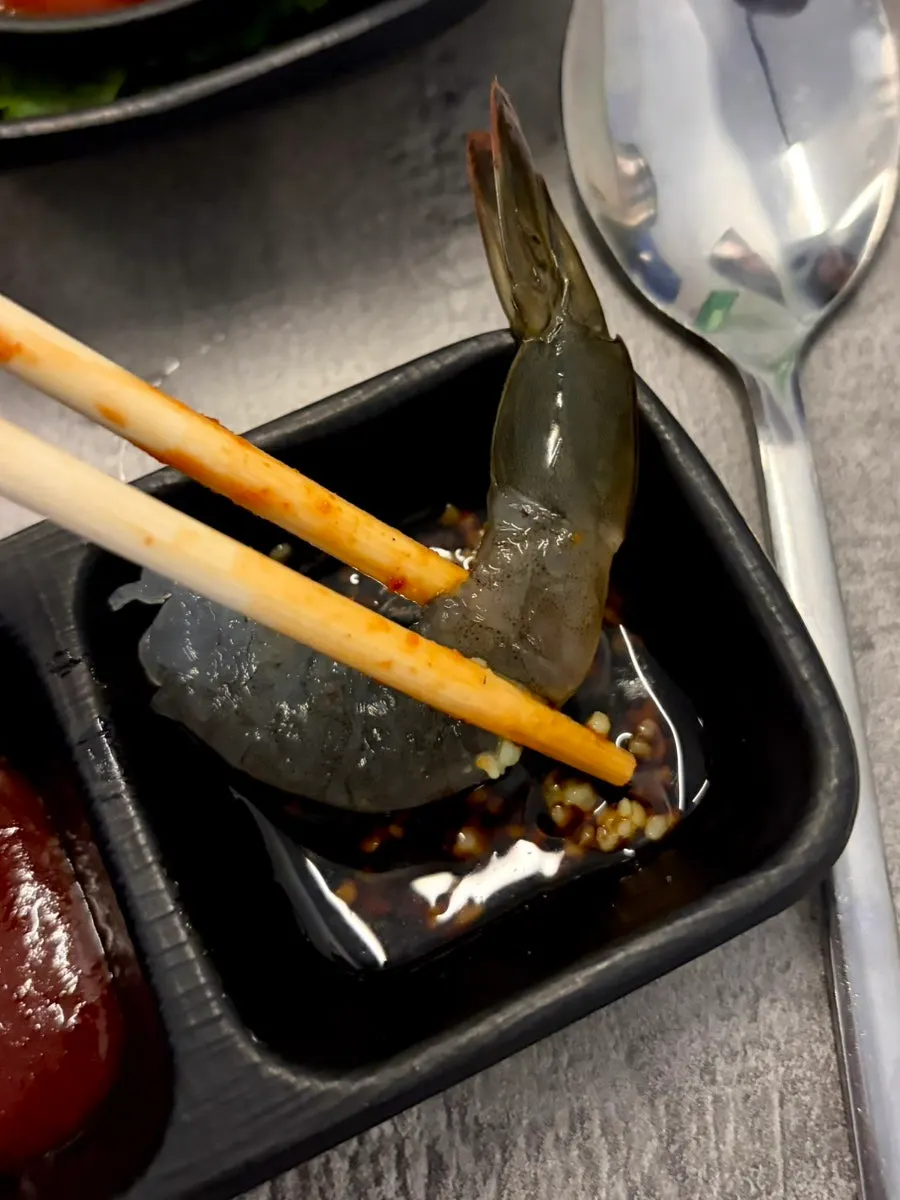 Close-up of the plump raw shrimp flesh