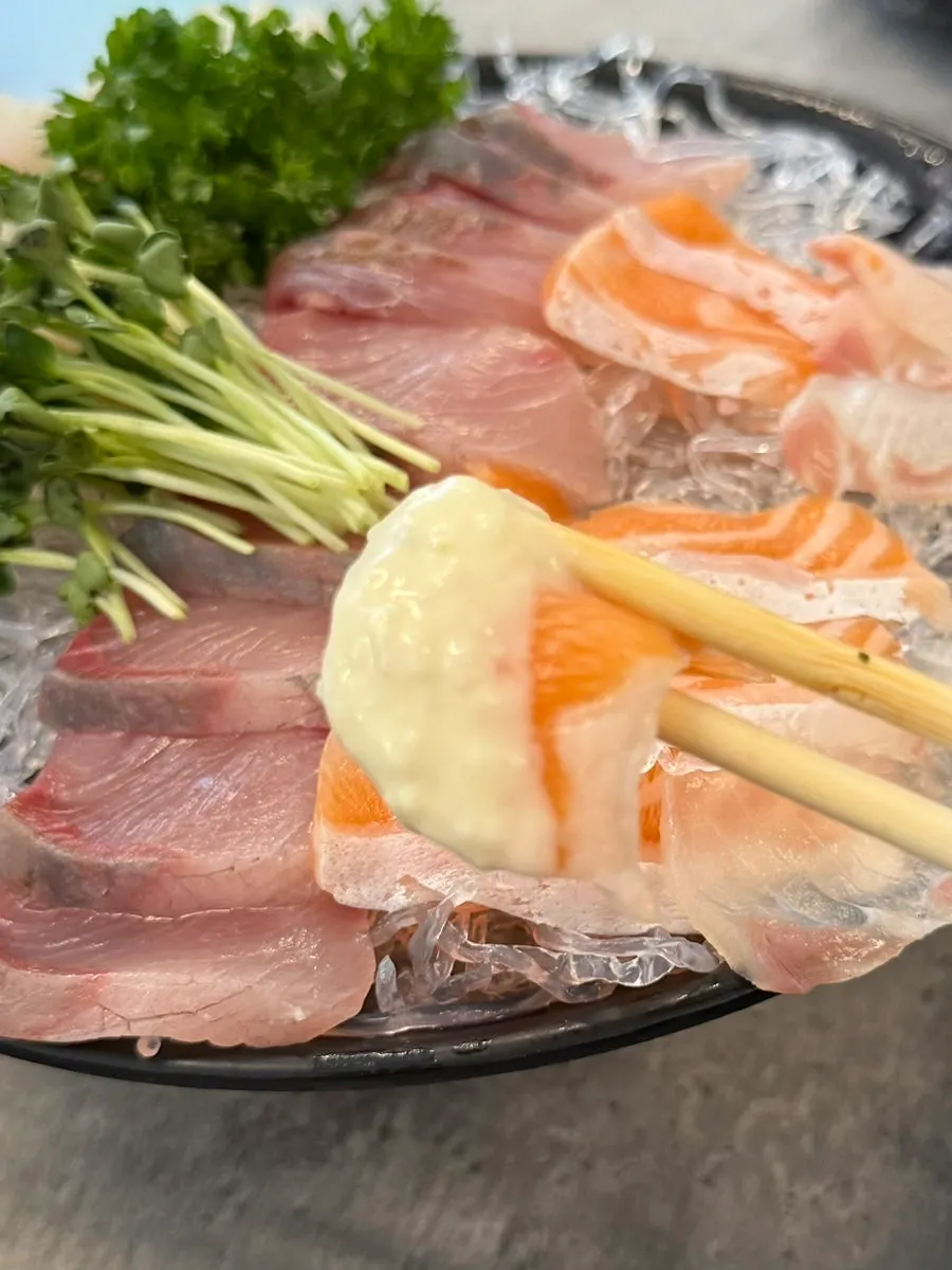 Table with sashimi and side dishes together
