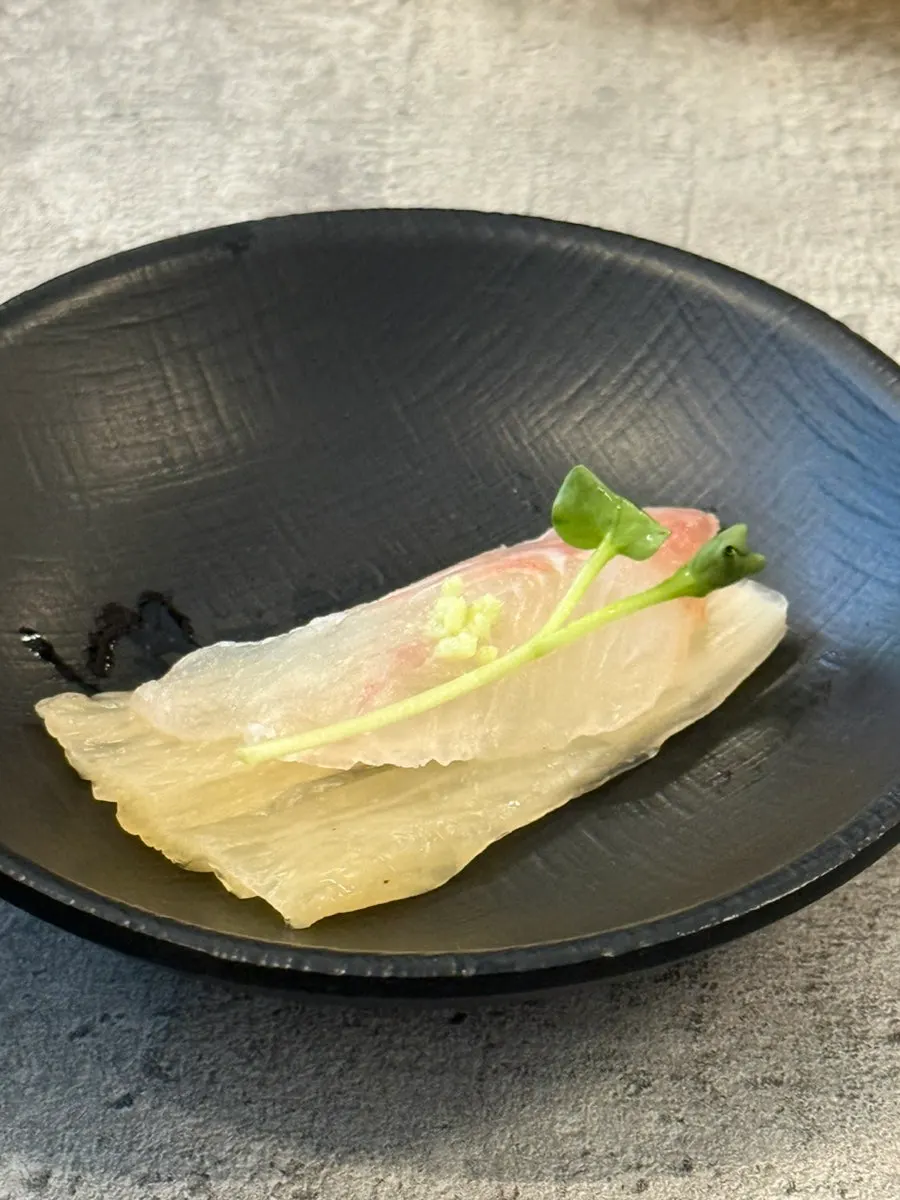 The assorted sashimi platter table near the end of the meal
