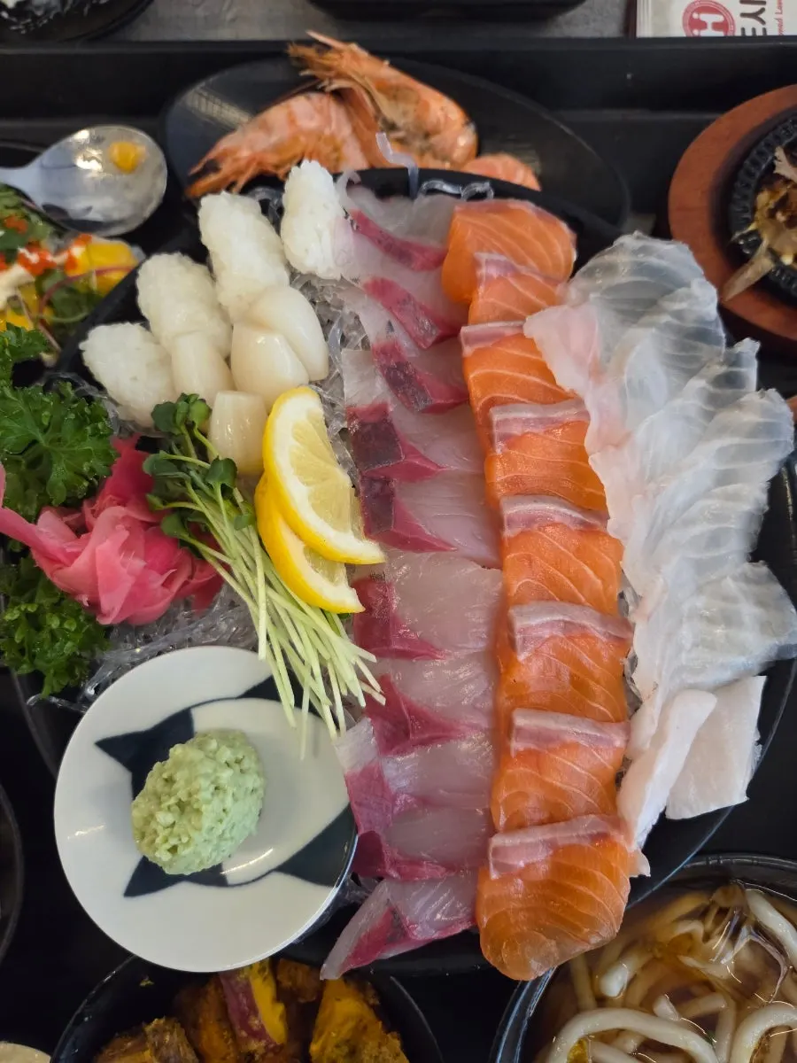 Glossy plate of aged live-fish assorted sashimi