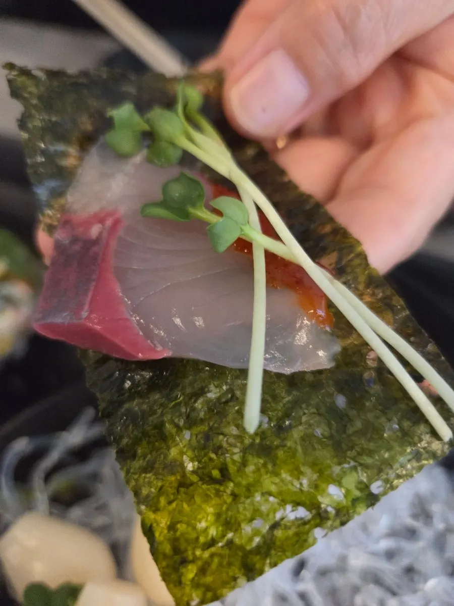 Ending the meal with a piece of sashimi and a glass of soju