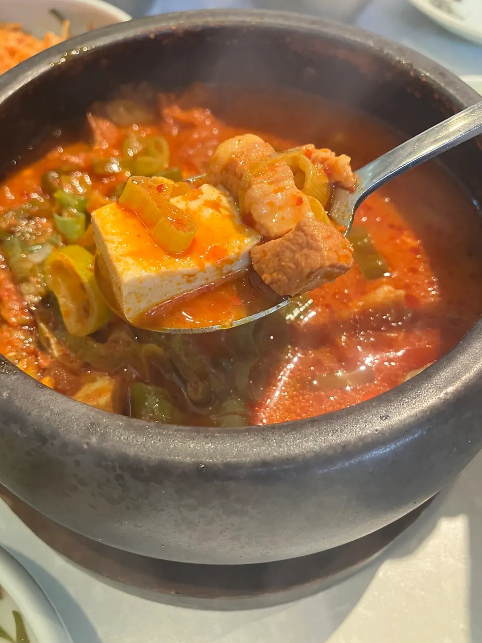 Stone pot rice and kimchi jjigae with meat inside