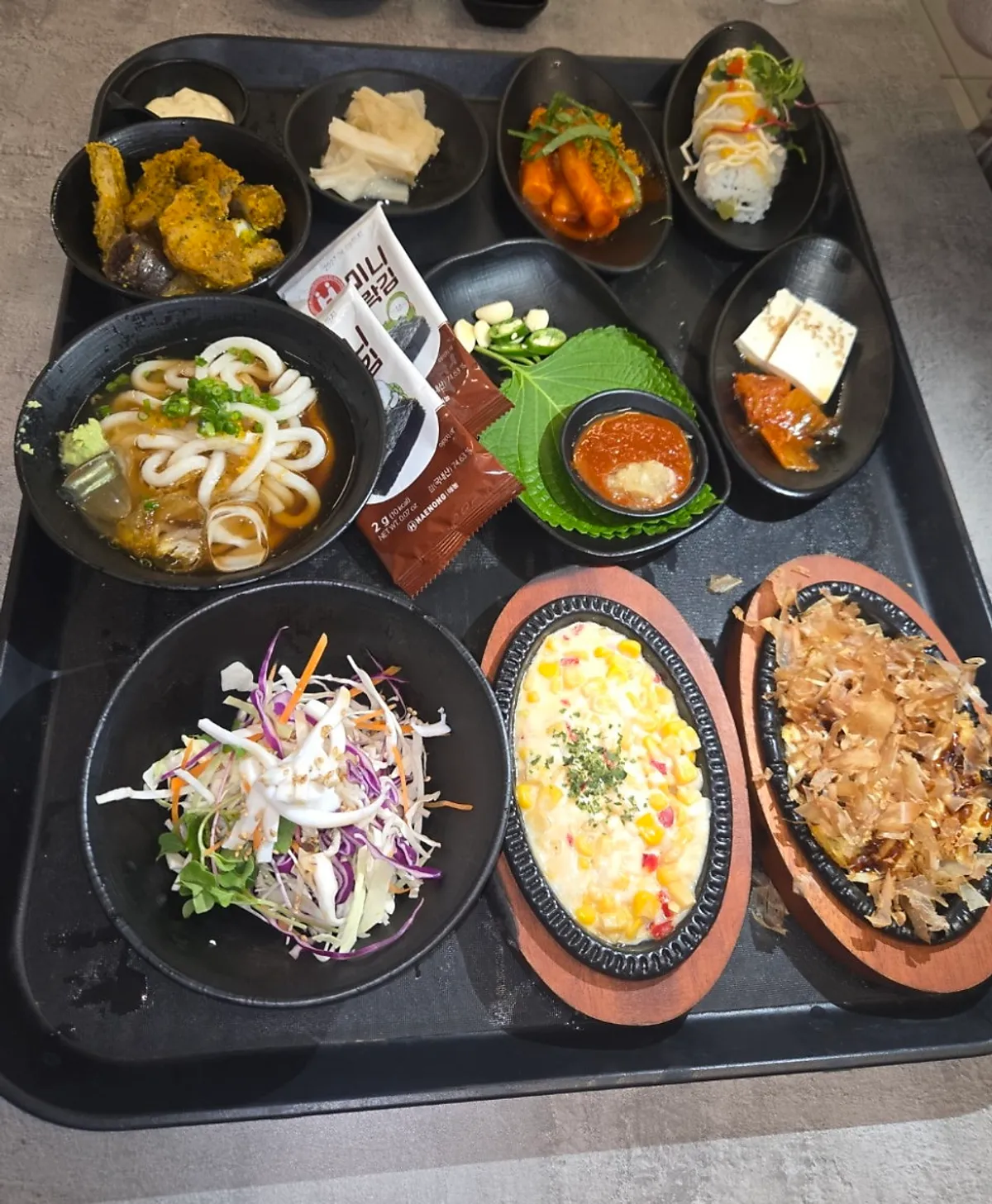 Fried food and salad served alongside the Rigo Susan spread