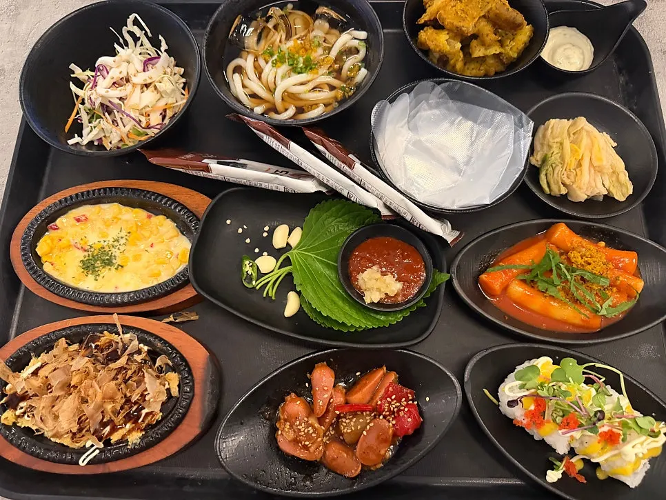 The full banchan spread laid out at once at Rigo Susan