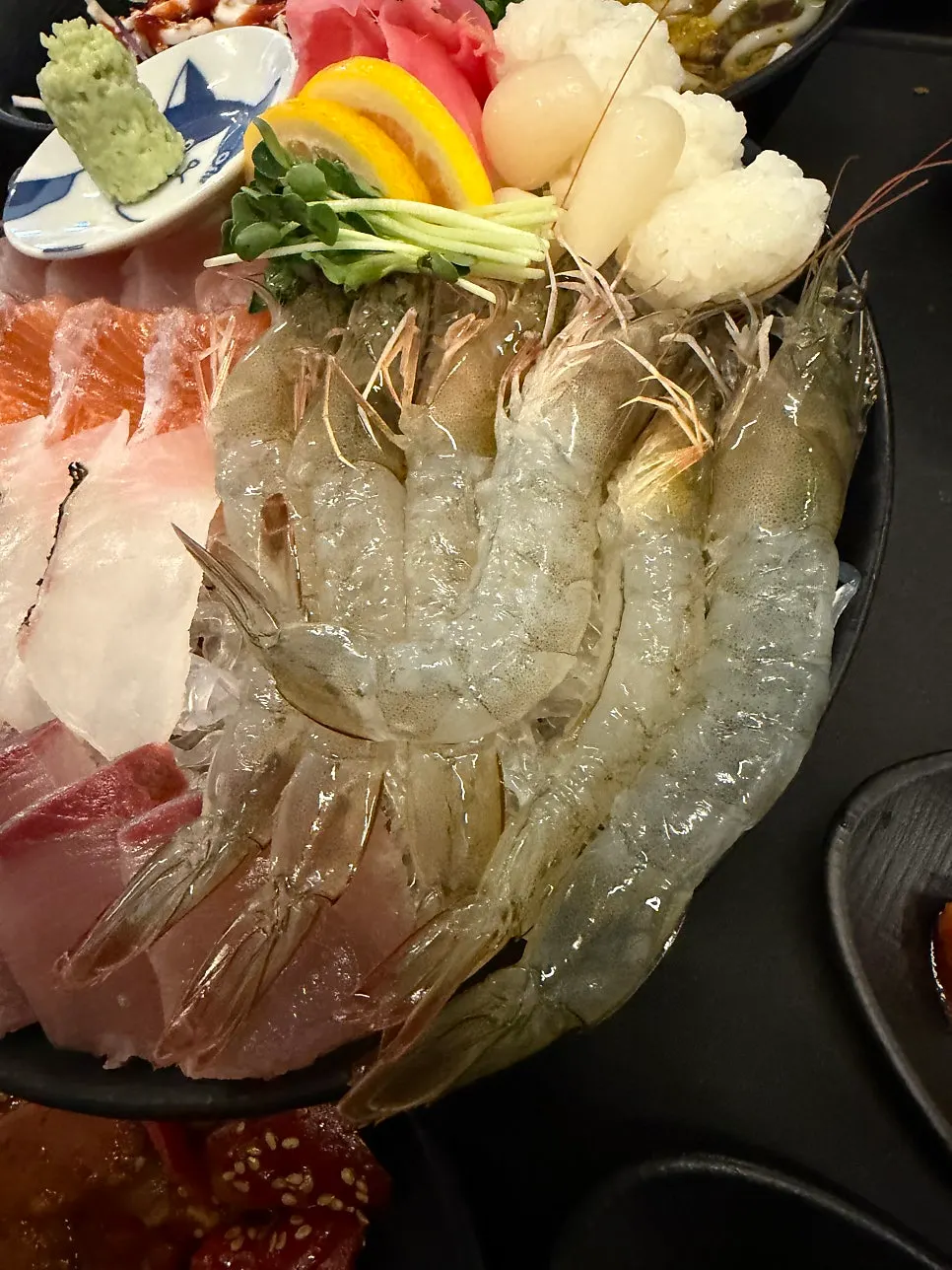 Freshly arrived raw shrimp laid out on ice