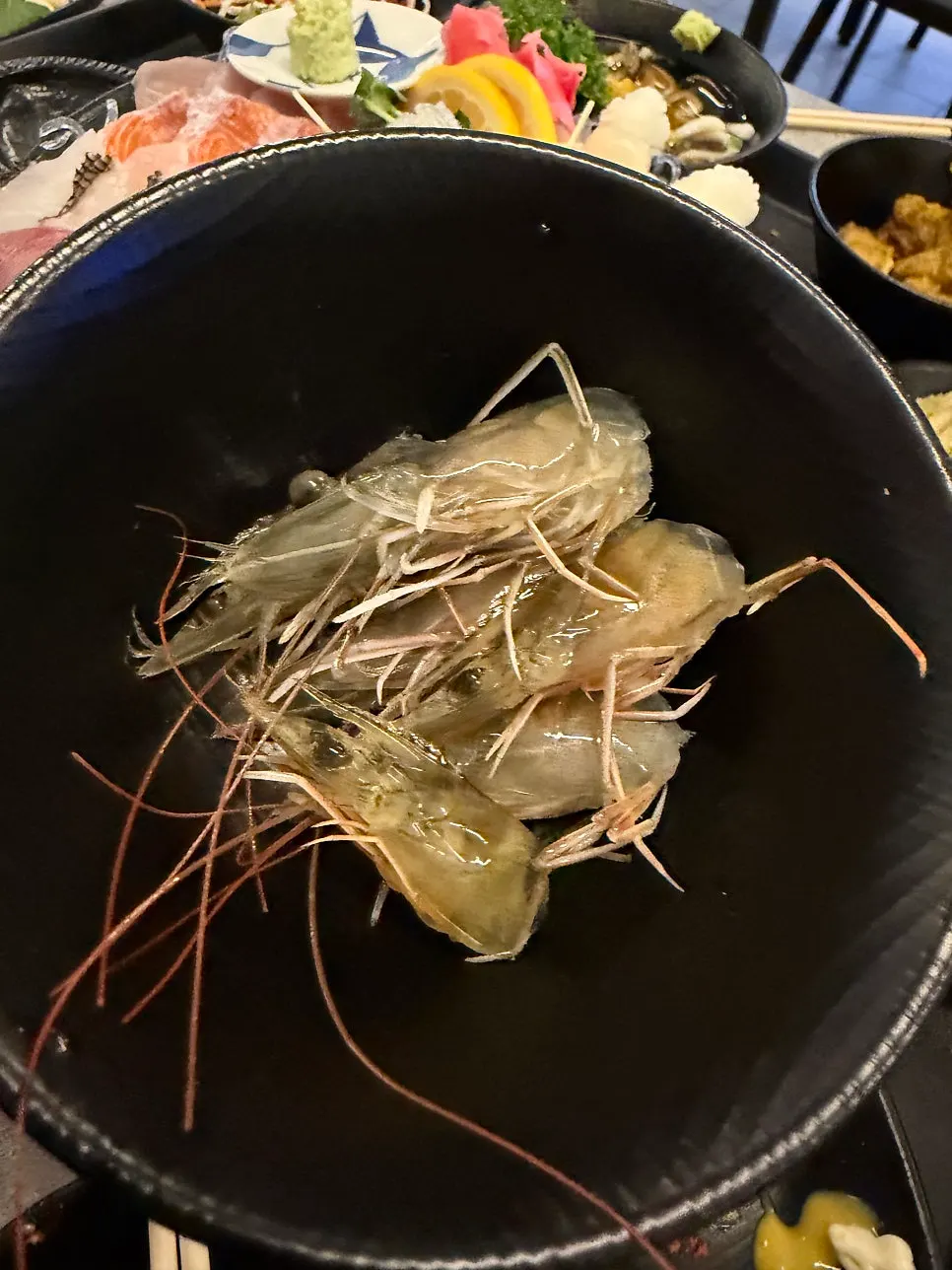 Fried shrimp heads sprinkled with parsley flakes