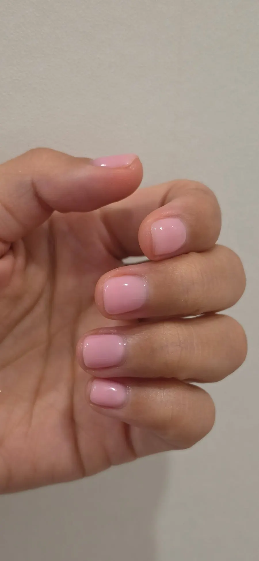 Nudie pink nails after finishing care is complete