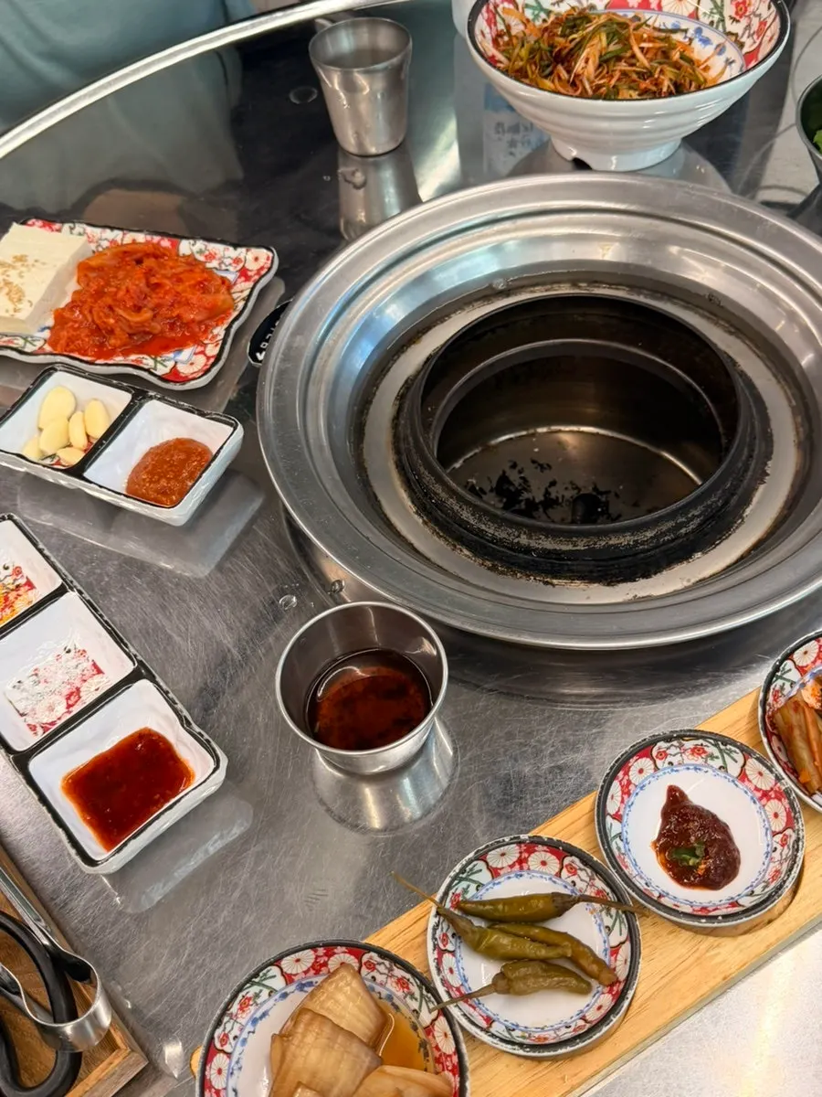 Complimentary side-dish spread served with pork