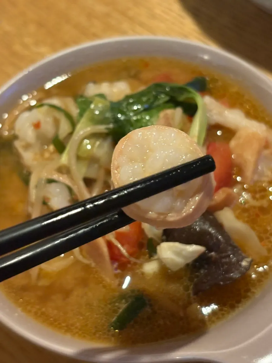 A plate of nabe with beef intestine and vegetables
